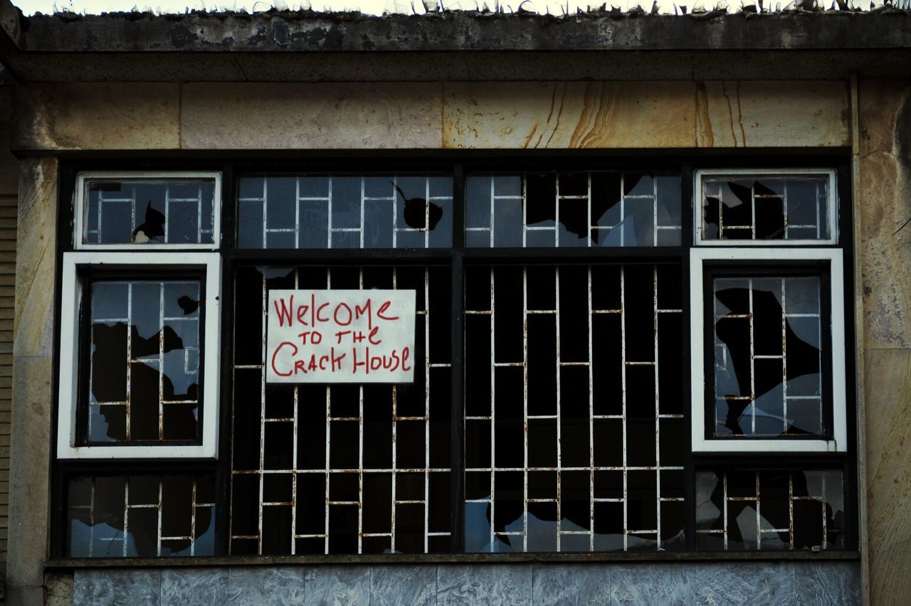 Close-up of welcome board on the window