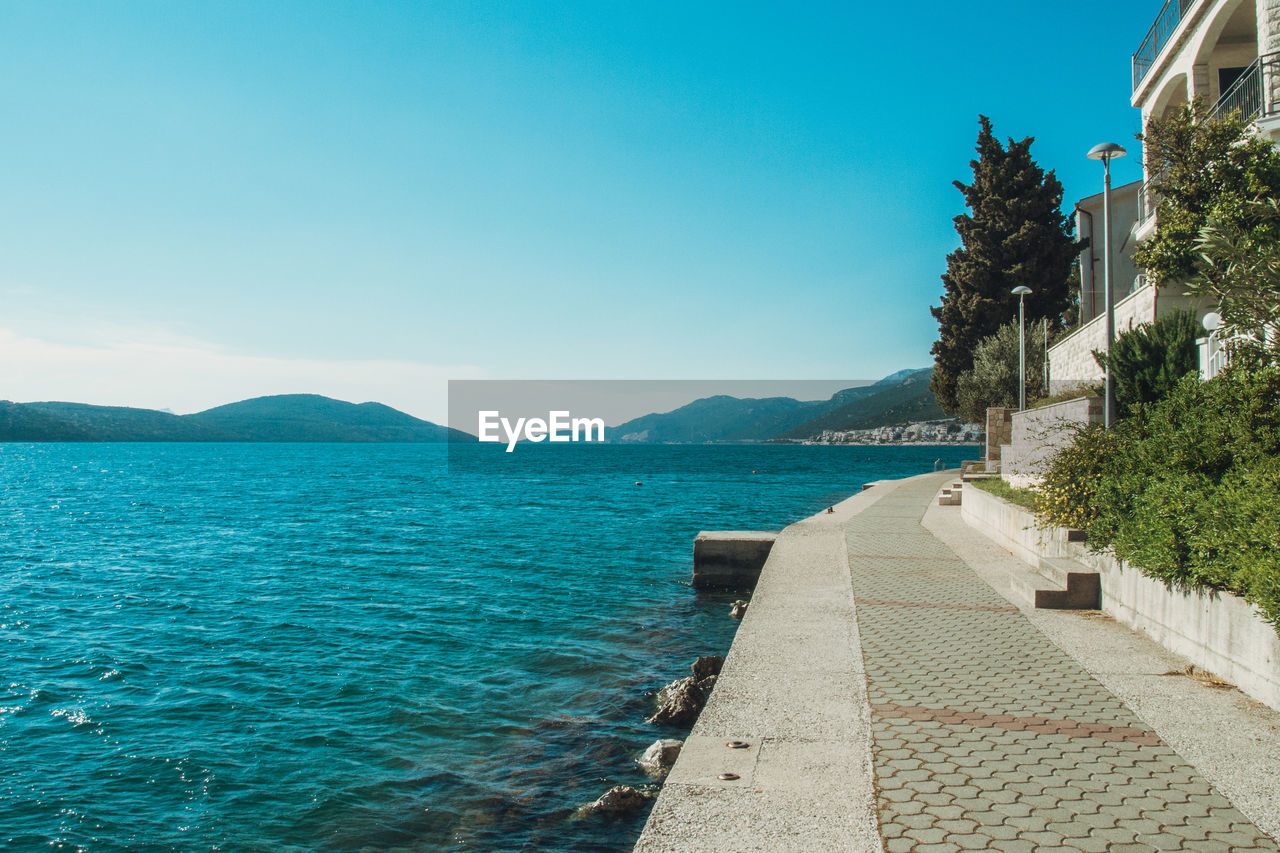 Scenic view of sea against clear blue sky