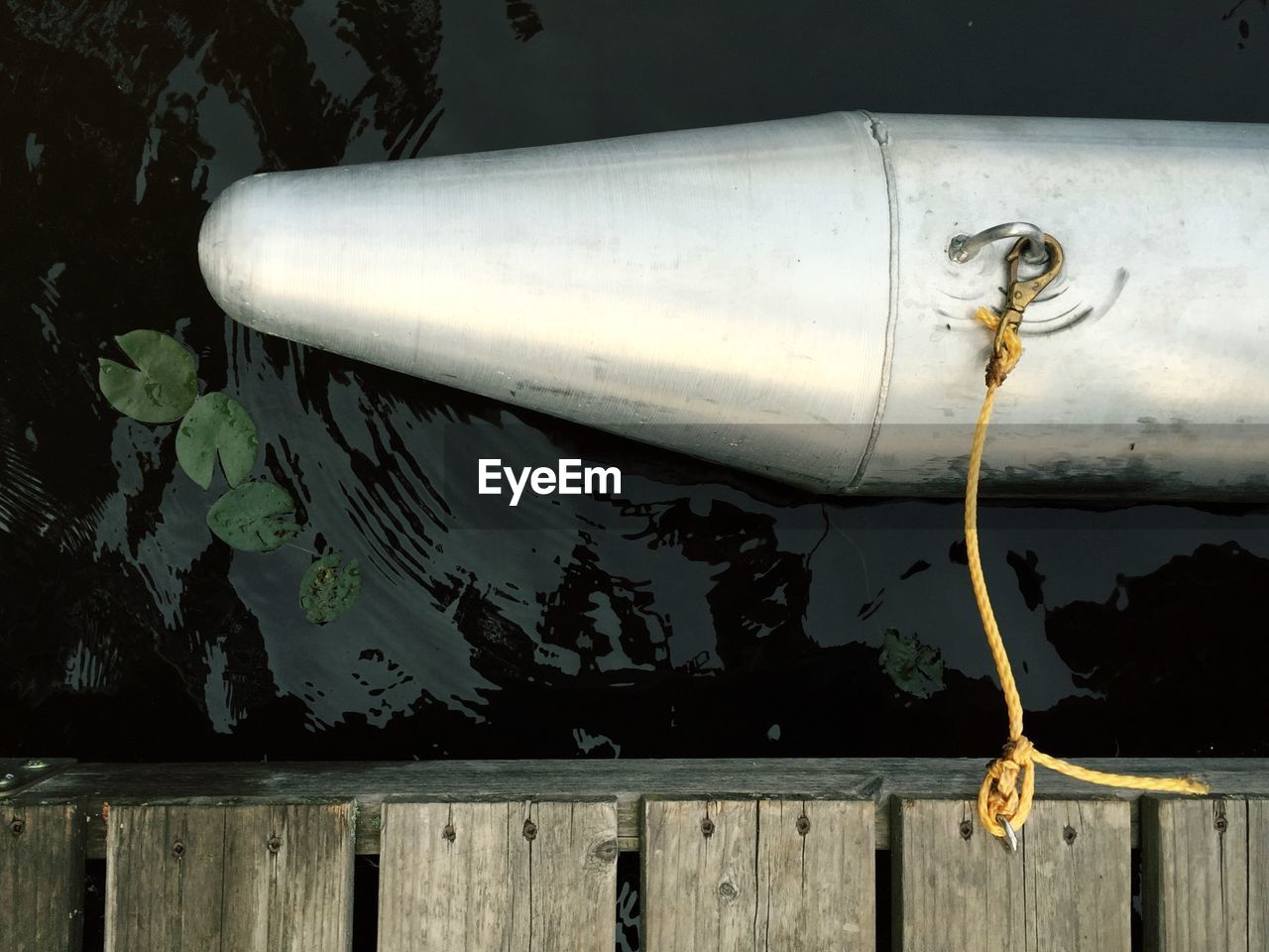 High angle view of metallic boat on lake