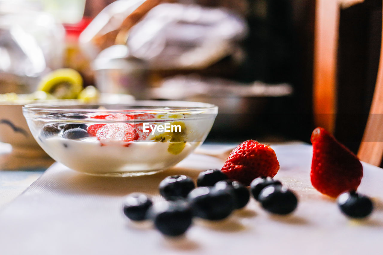 CLOSE-UP OF FRUITS SERVED ON TABLE