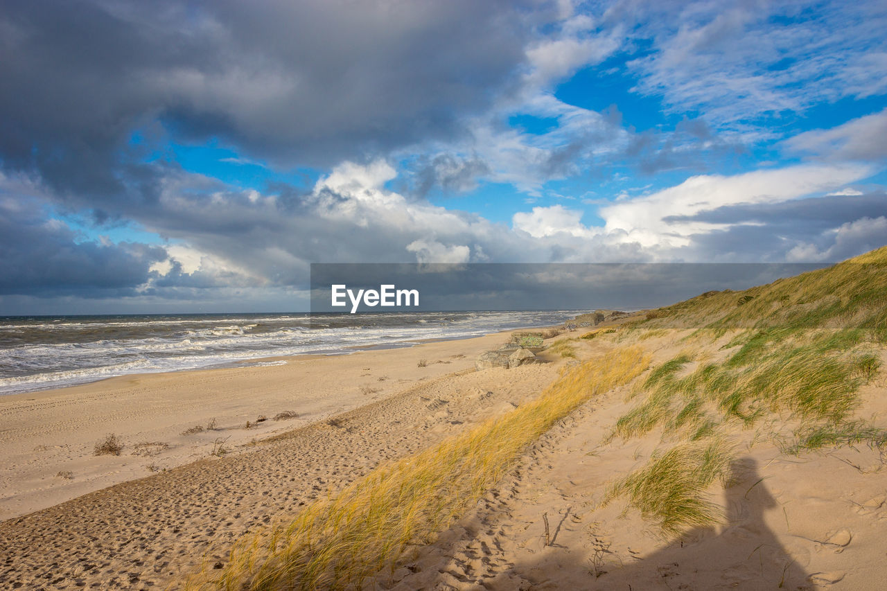 Scenic view of beach against sky