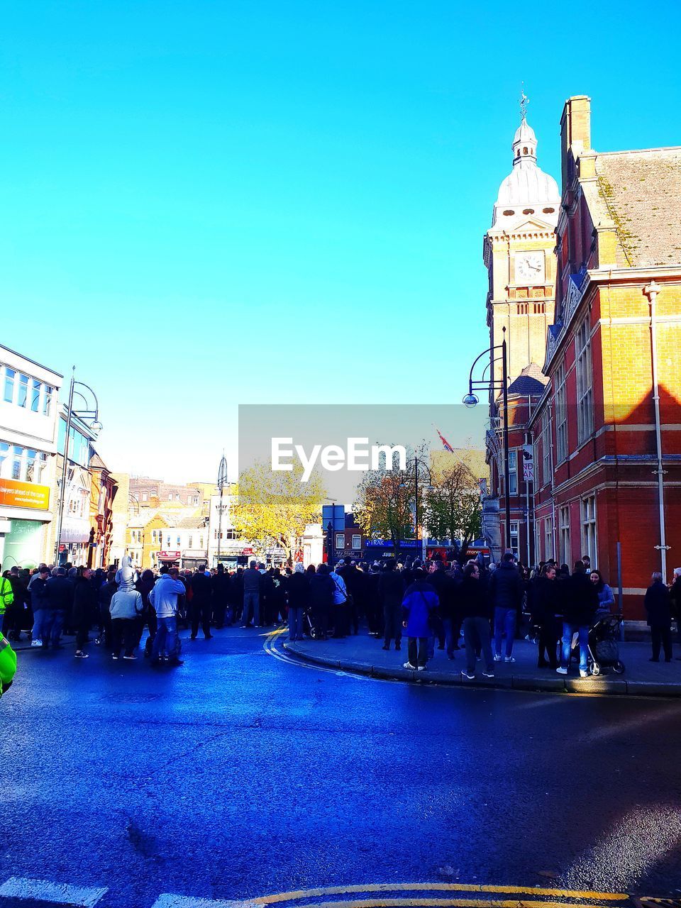 GROUP OF PEOPLE ON CITY STREET