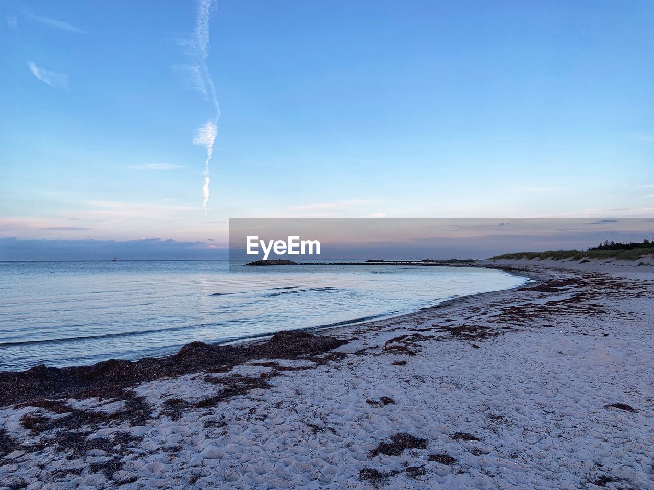 PANORAMIC VIEW OF SEA AGAINST SKY DURING SUNSET