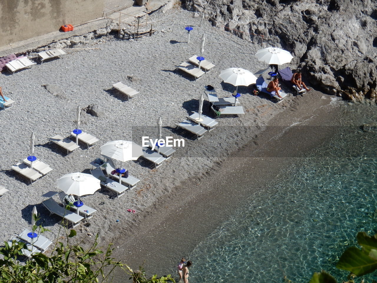 HIGH ANGLE VIEW OF PEOPLE ENJOYING AT BEACH