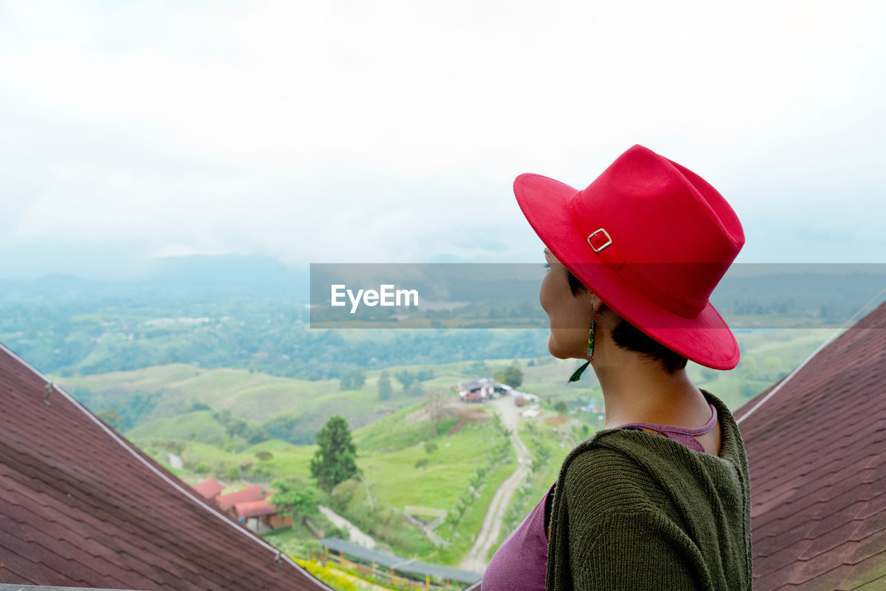 side view of woman looking at mountain