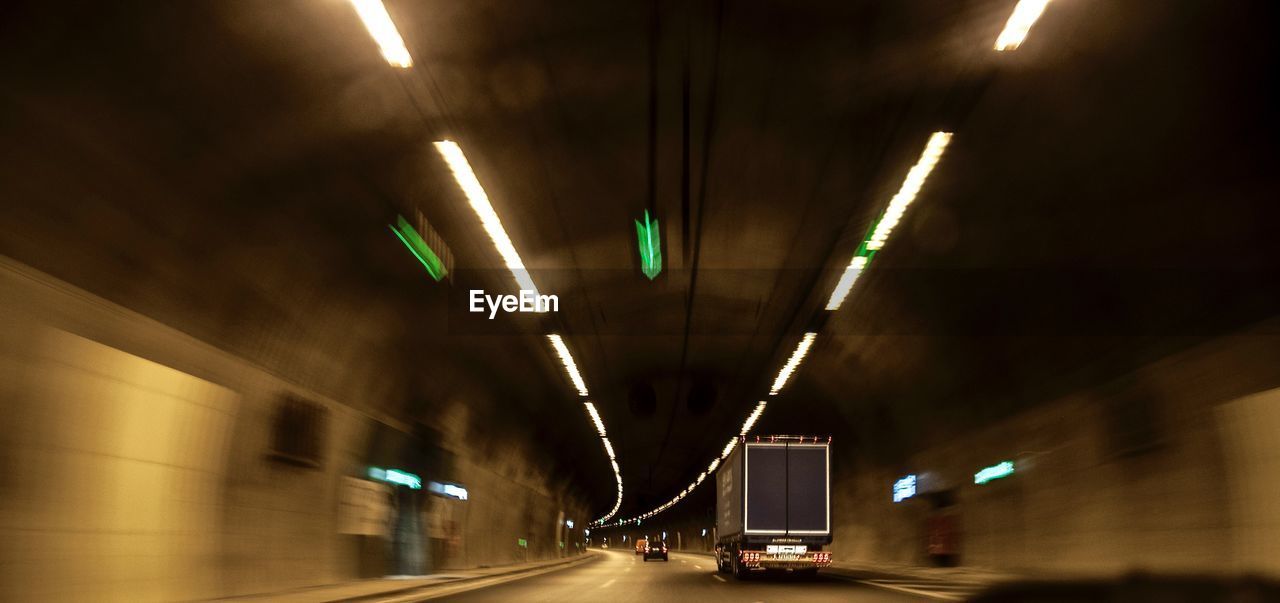 Blurred view of cars driving in tunnel