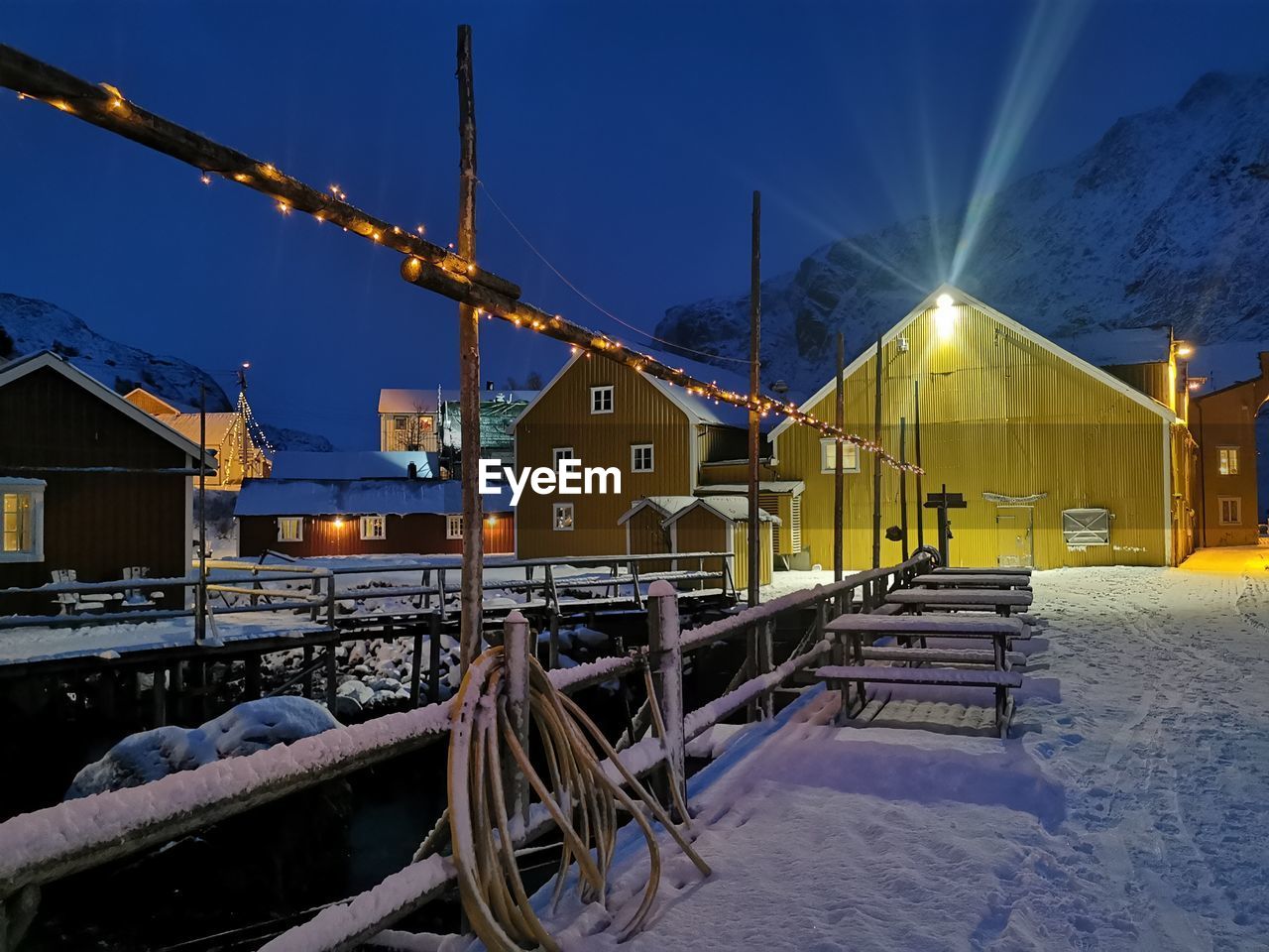 bridge over river against sky during winter