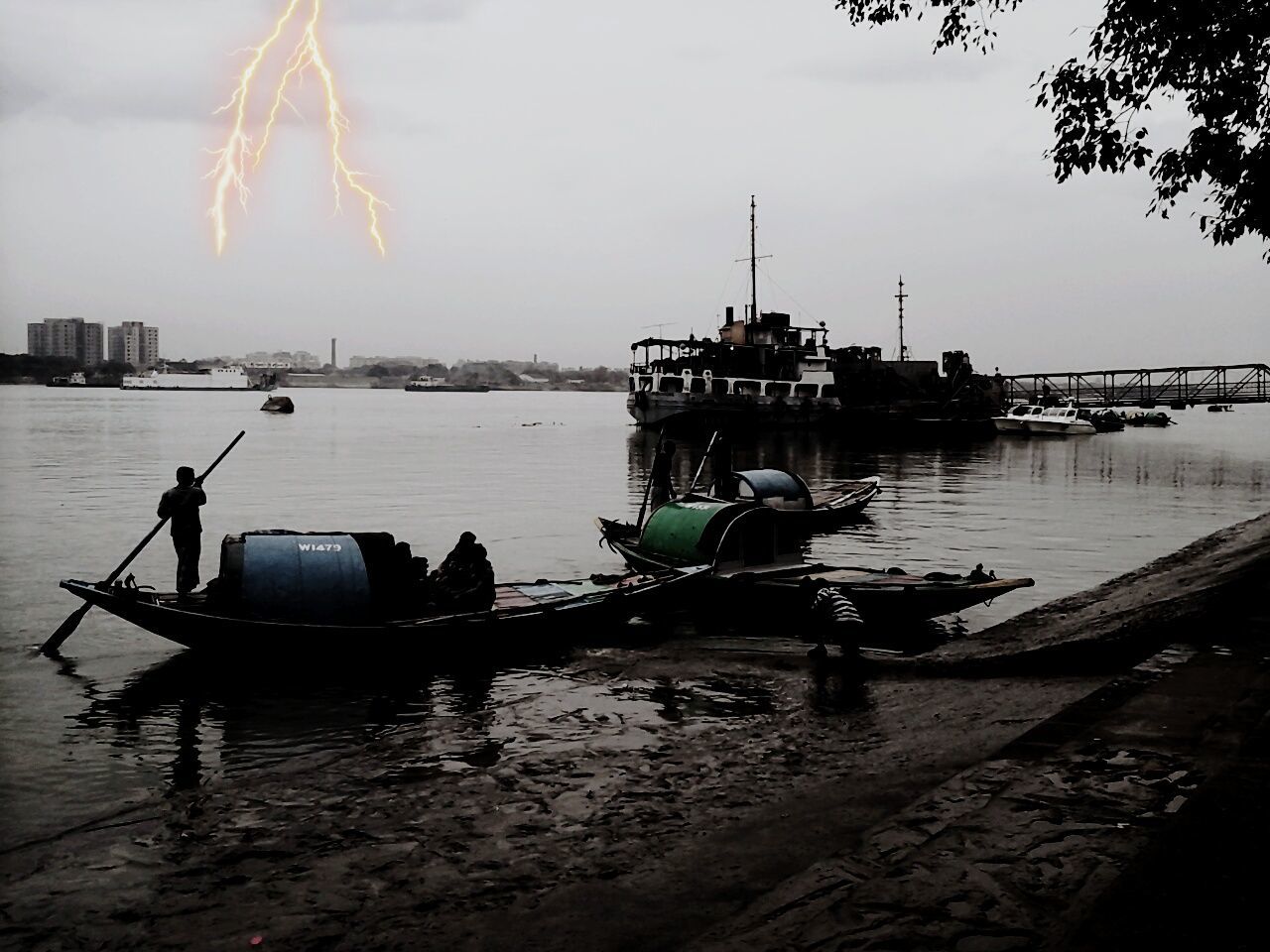 BOATS MOORED ON SEA