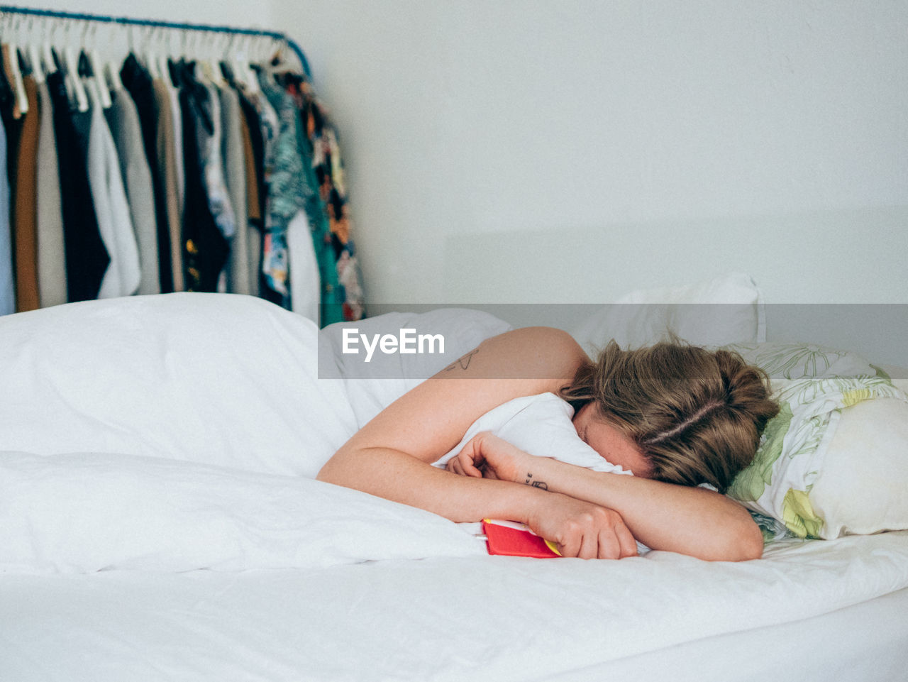 Young woman sleeping on bed