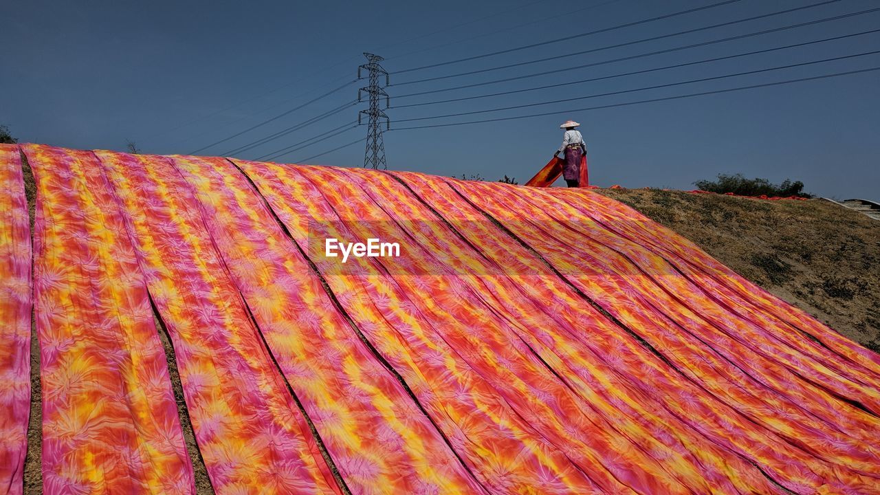 Low angle view of textile drying on land