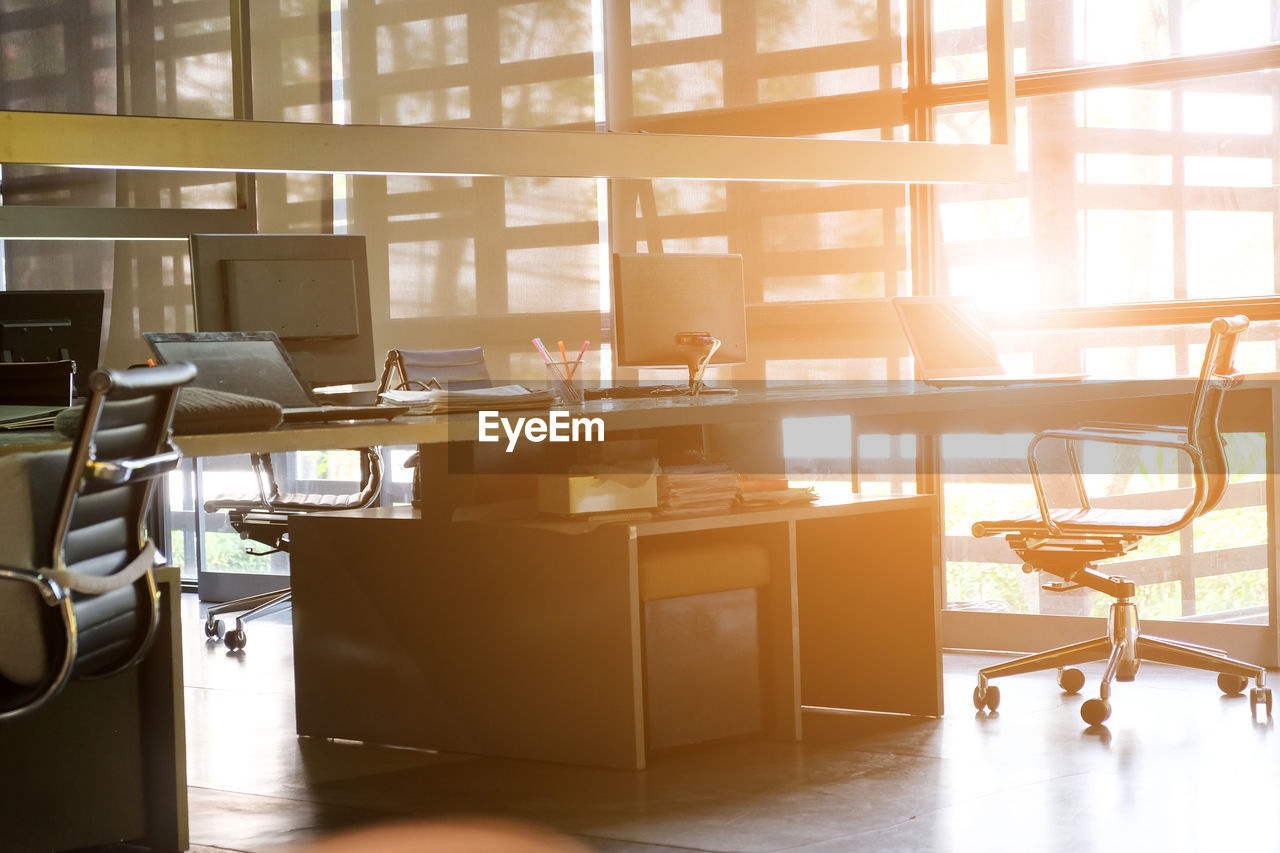 Empty chair in bright office