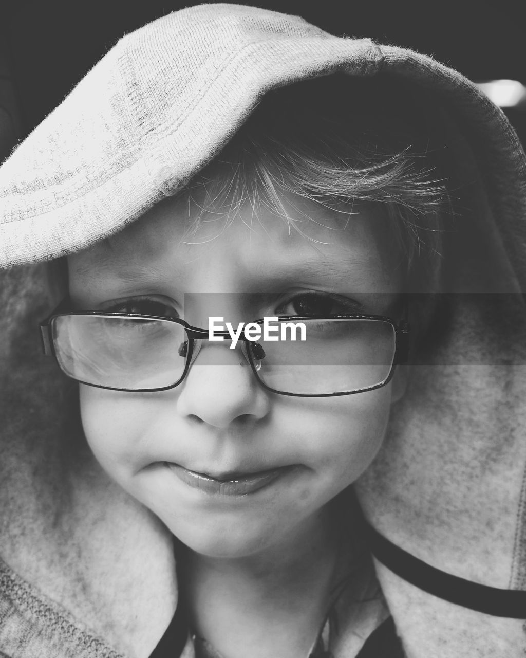 Close-up portrait of boy wearing eyeglasses