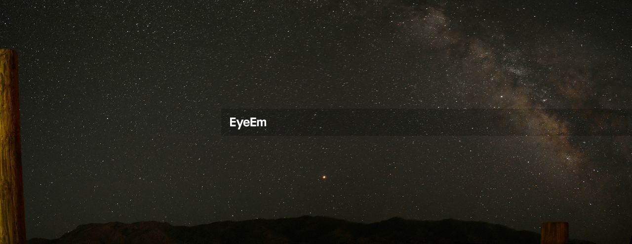 Low angle view of star field against sky at night