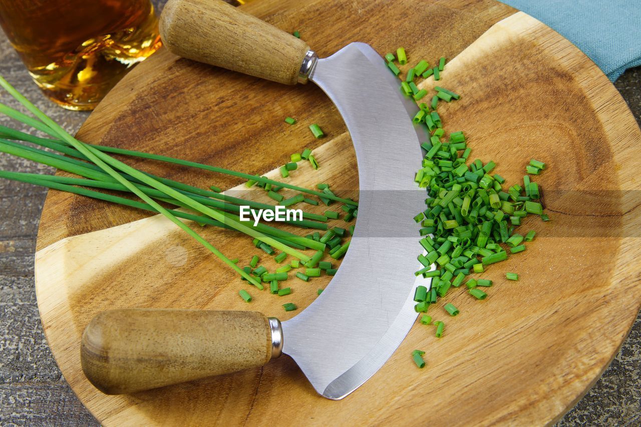 HIGH ANGLE VIEW OF CHOPPED VEGETABLES IN KITCHEN