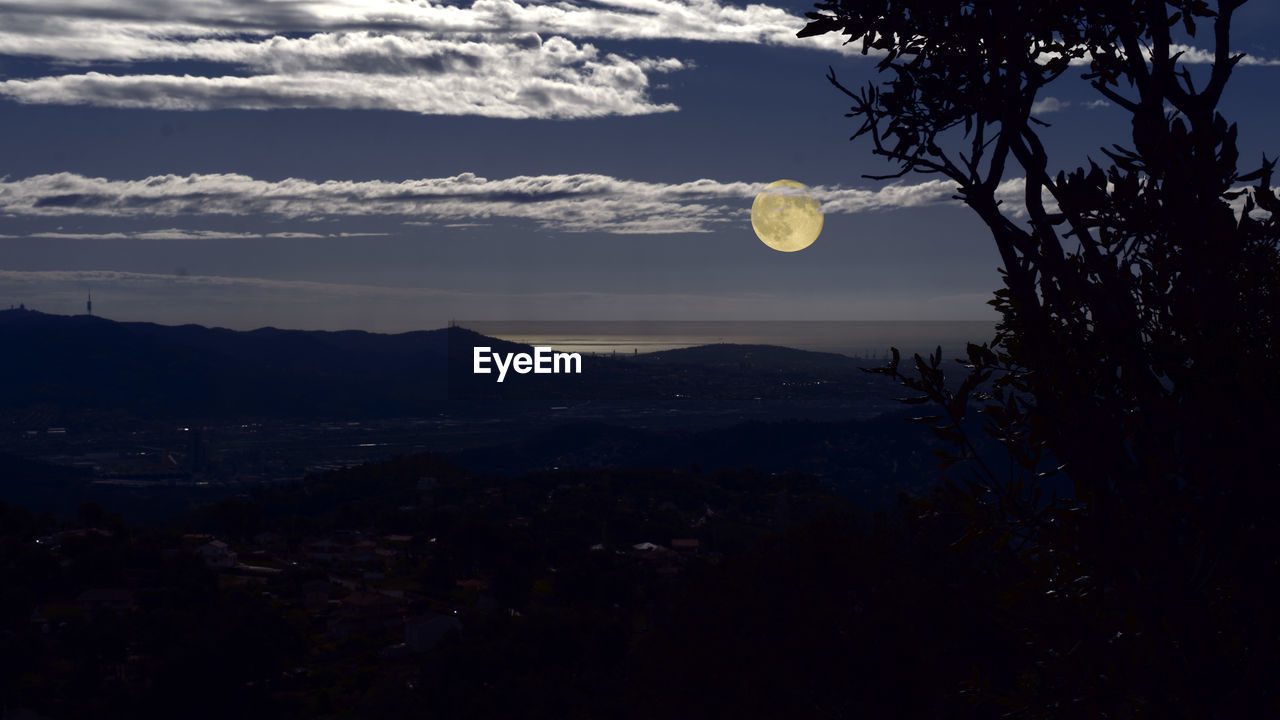 Scenic view of landscape against sky during dusk