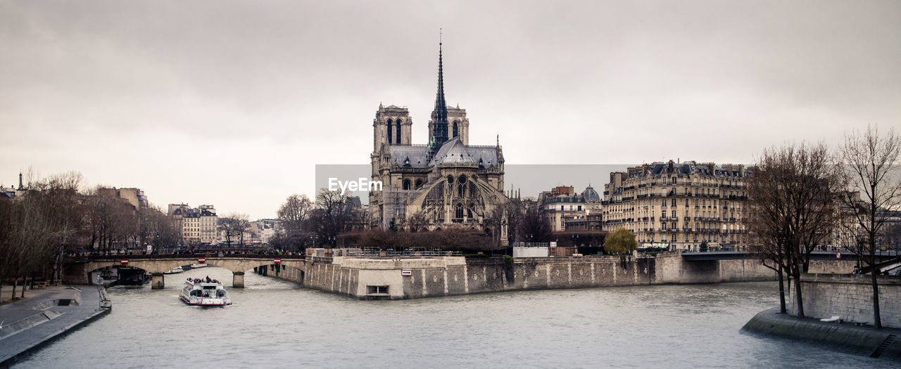 VIEW OF BUILDINGS BY RIVER