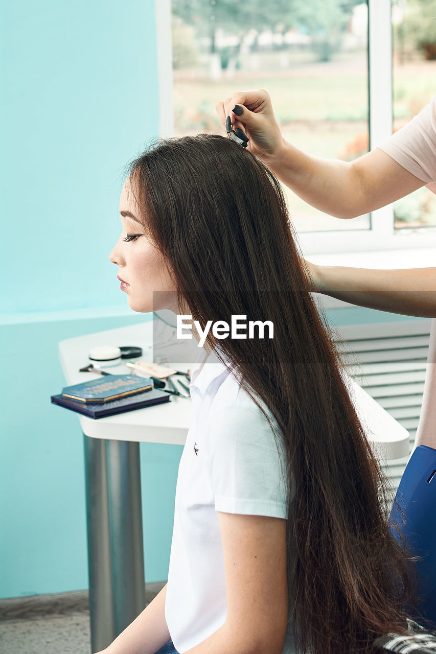 High school girls students comb their hair. anime style