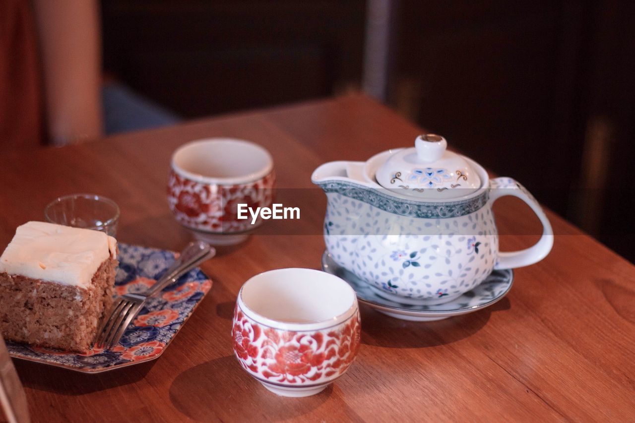 Bakery and chinese style tea set on table