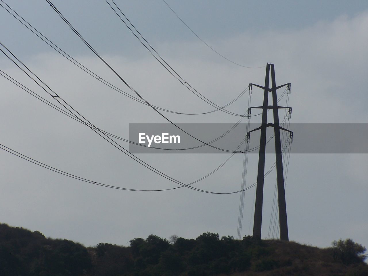 LOW ANGLE VIEW OF ELECTRICITY PYLONS