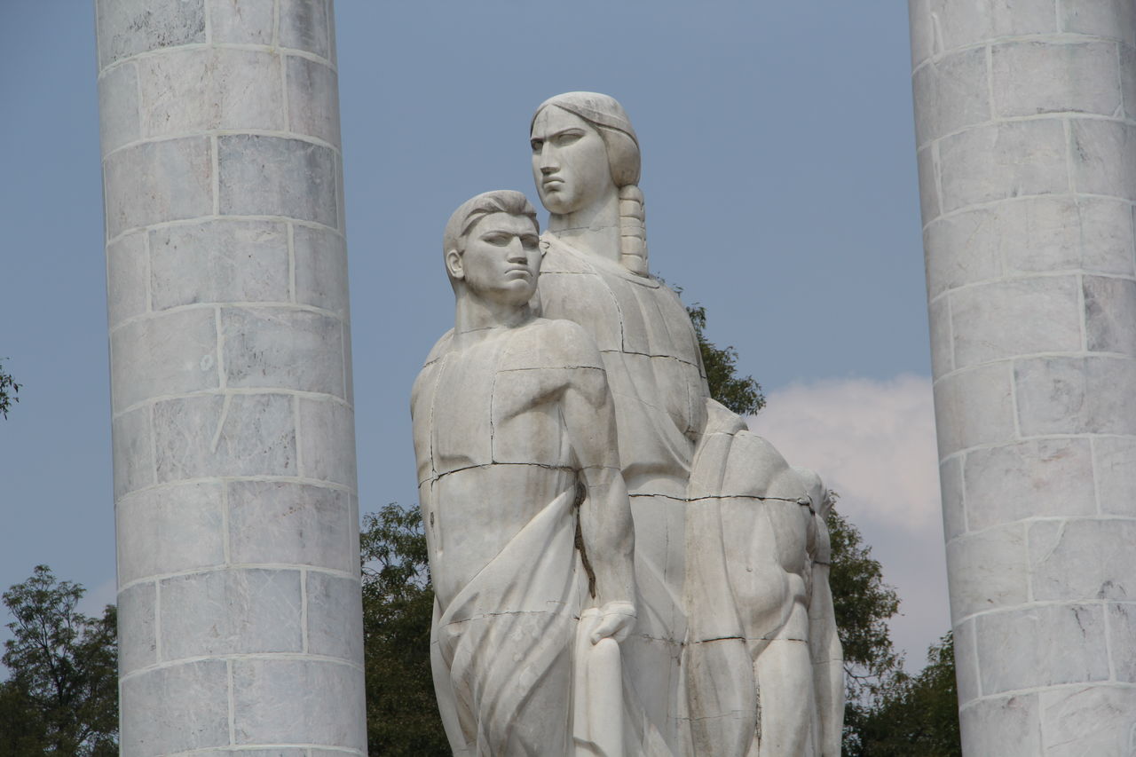 Low angle view of statue against sky