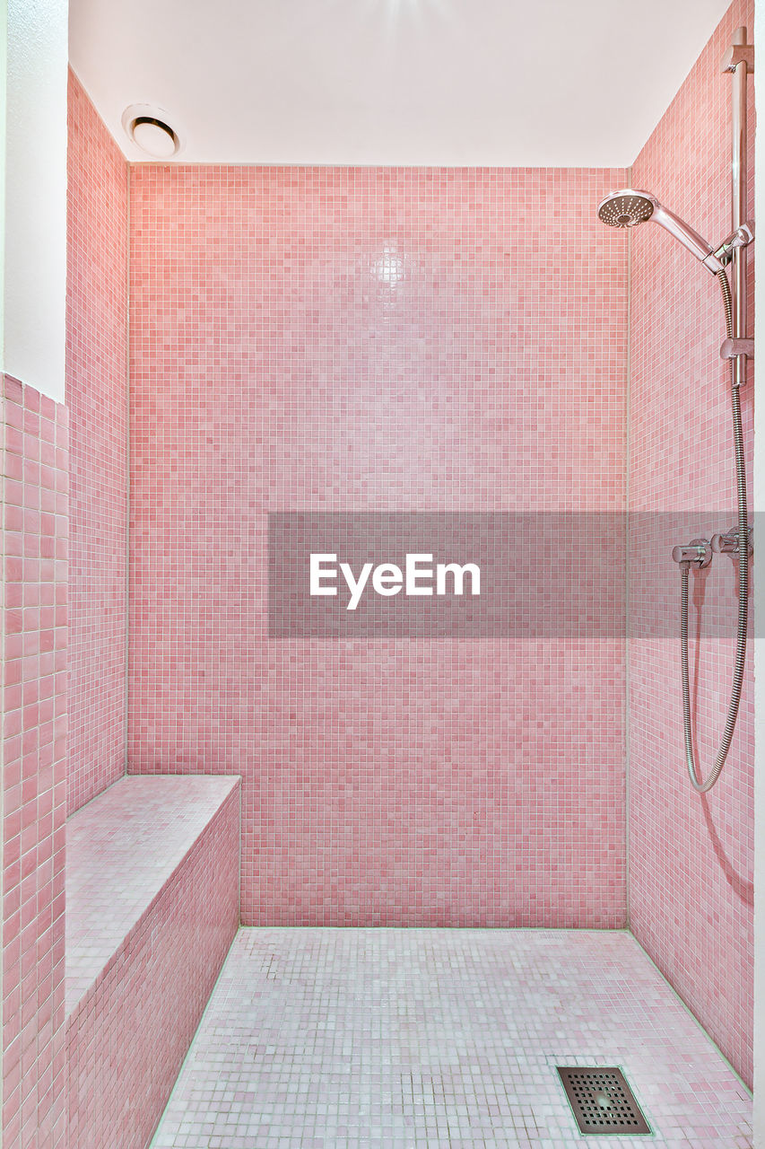 Modern shower stall in a bright bathroom