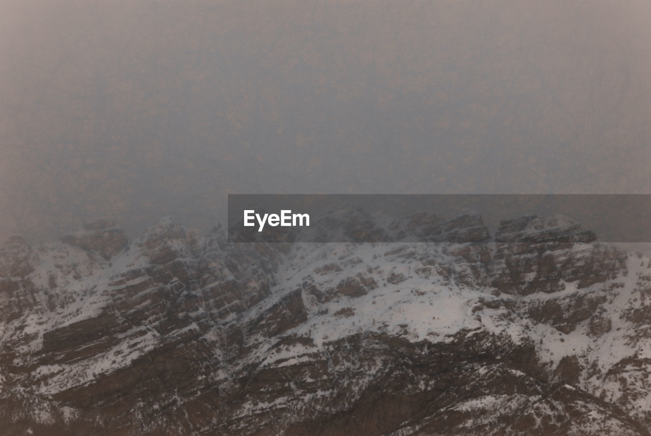 CLOSE-UP OF SNOW COVERED LANDSCAPE