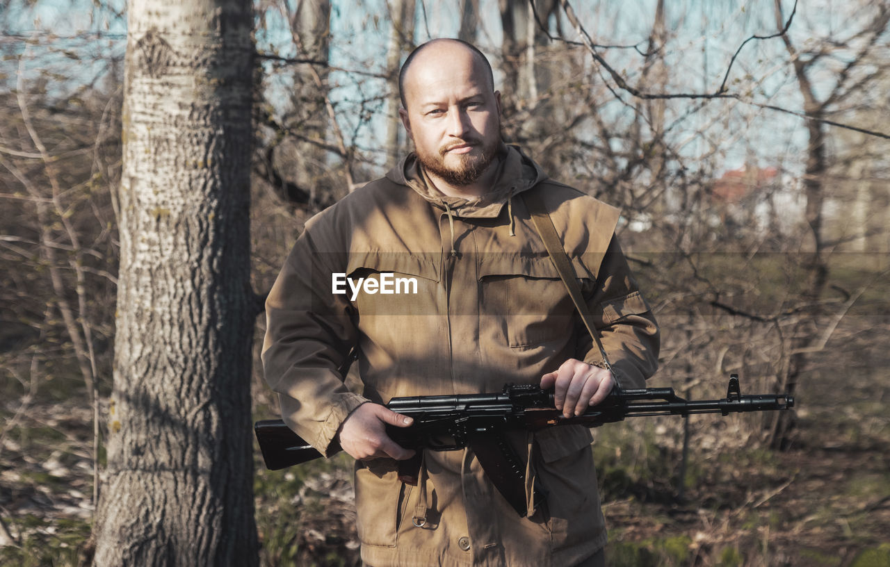 Portrait of soldier in forest