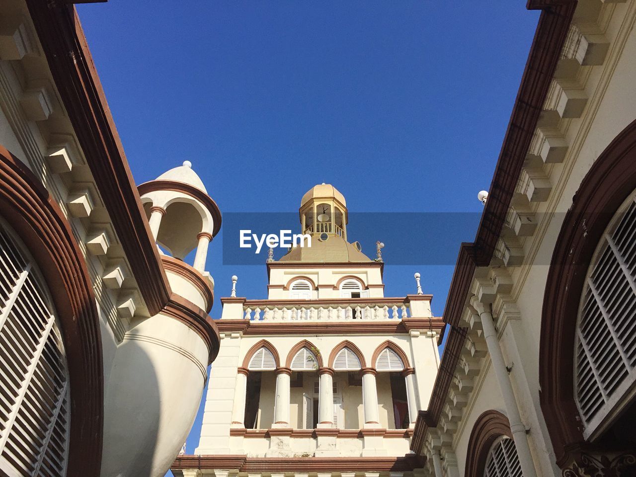 LOW ANGLE VIEW OF CHURCH AGAINST CLEAR BLUE SKY