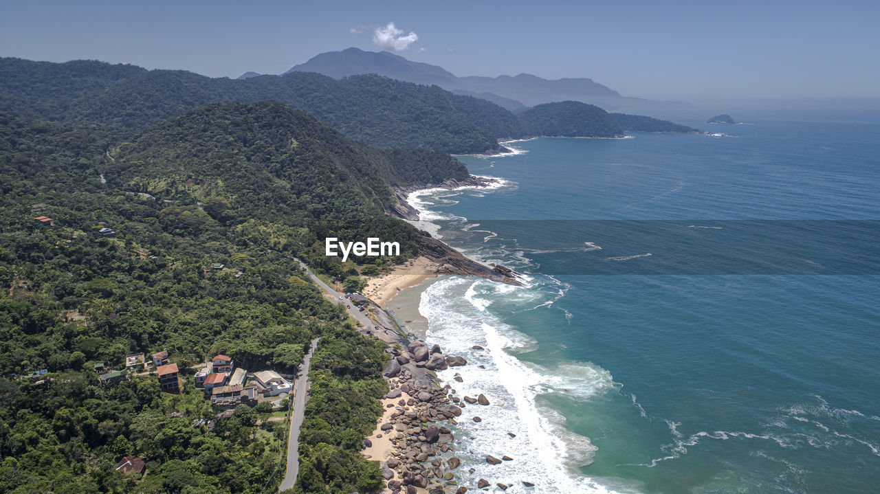 high angle view of sea and mountains against sky