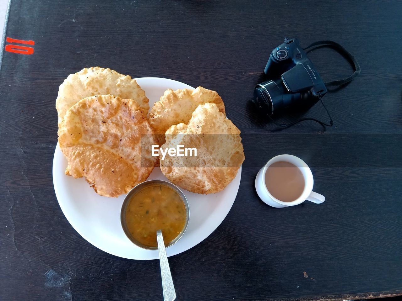 HIGH ANGLE VIEW OF BREAKFAST SERVED WITH COFFEE AND SPOON