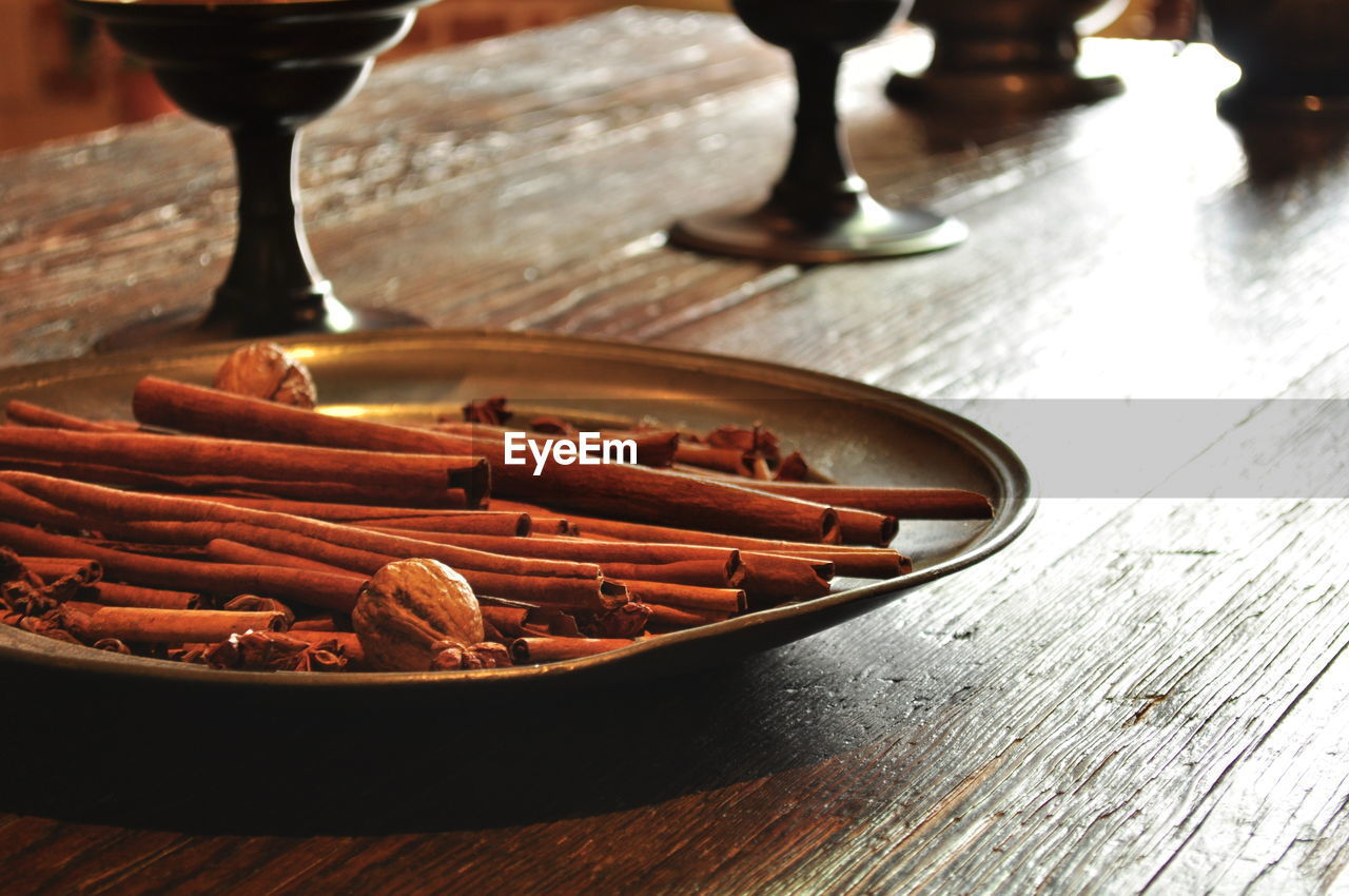 Close-up of cinnamon sticks in plate