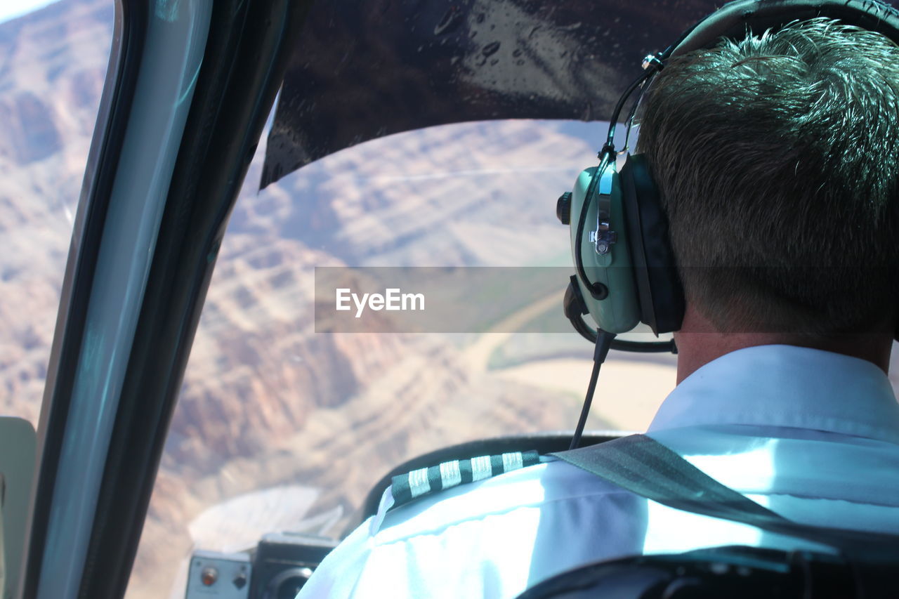 Close-up rear view of a helicopter pilot