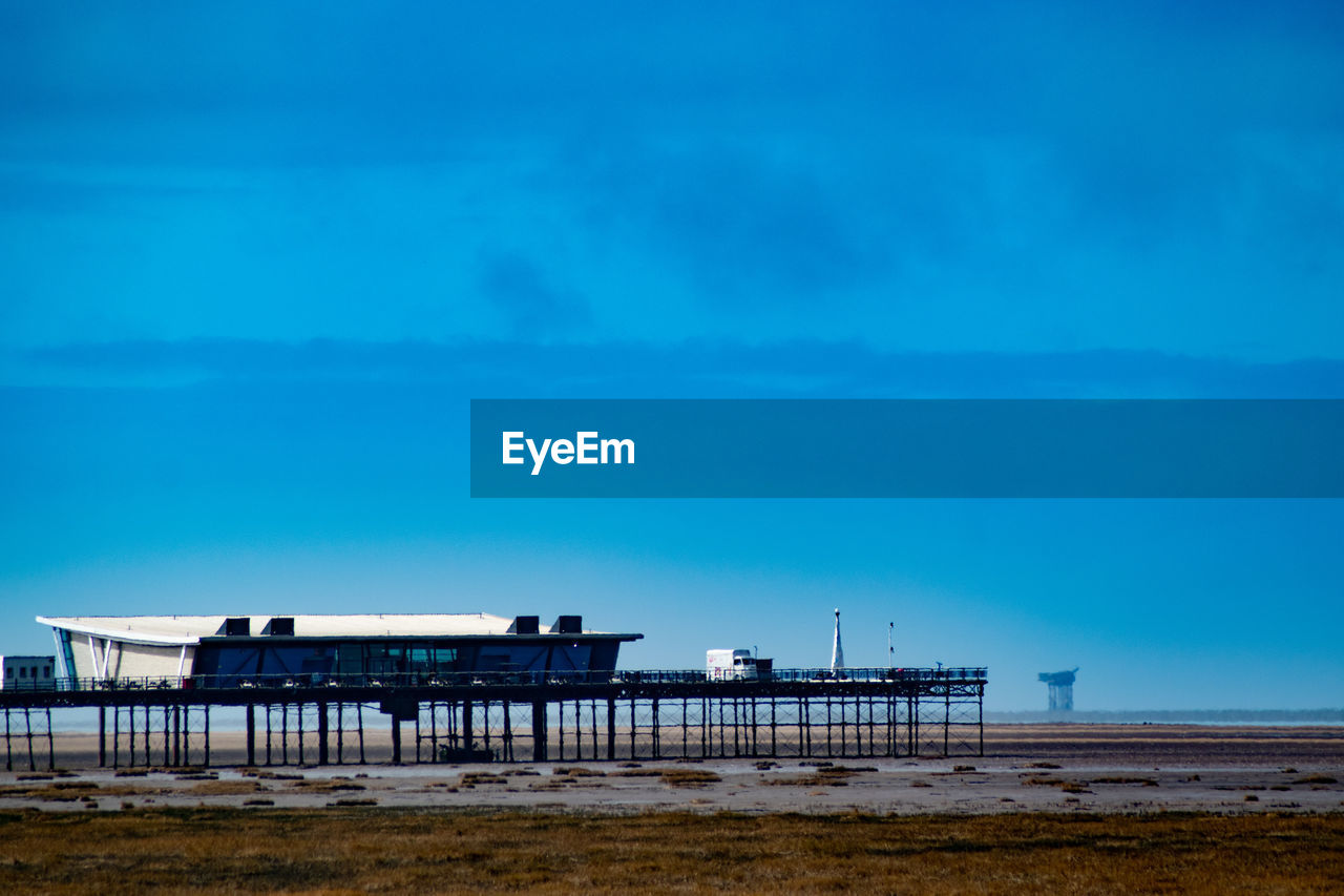 PIER OVER SEA AGAINST SKY