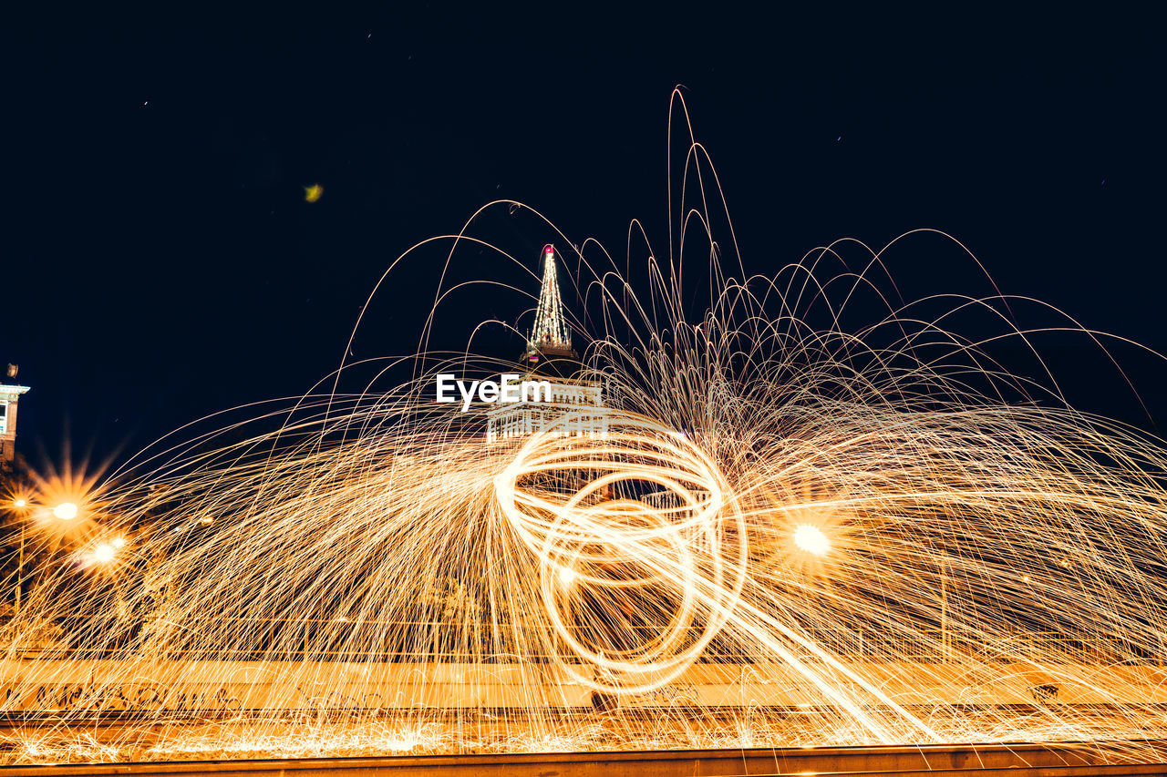 Light trails against sky at night