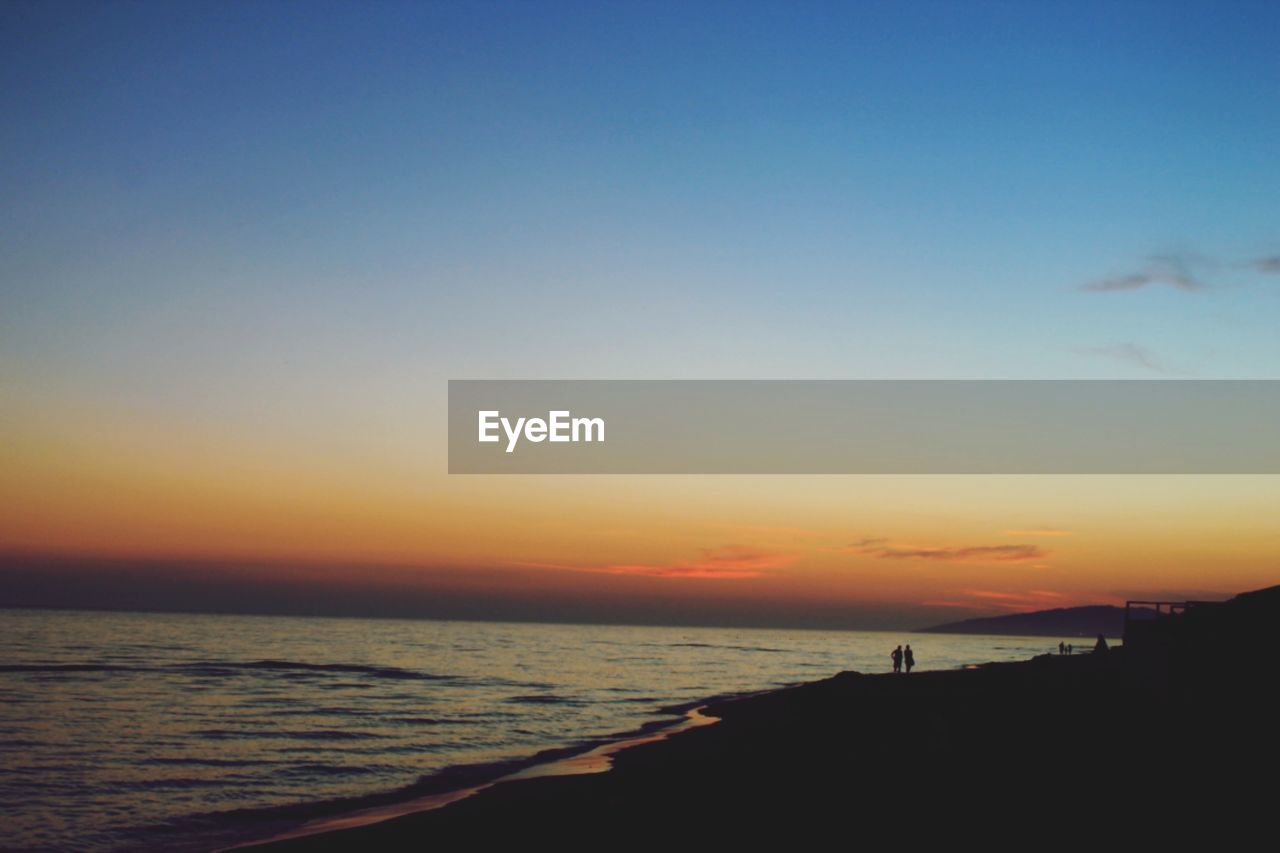 Scenic view of beach during sunset