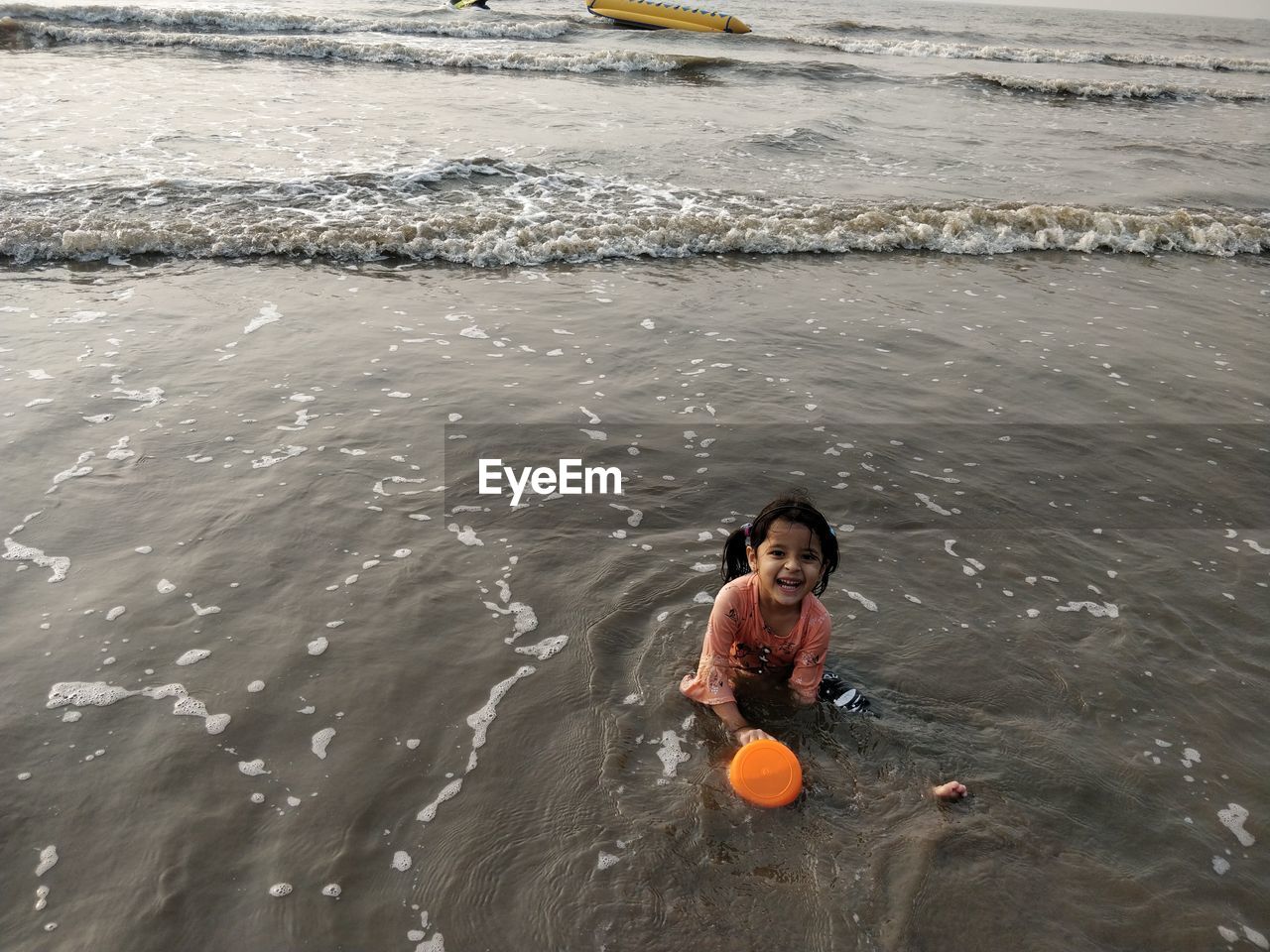 HIGH ANGLE VIEW PORTRAIT OF GIRL SWIMMING IN SEA