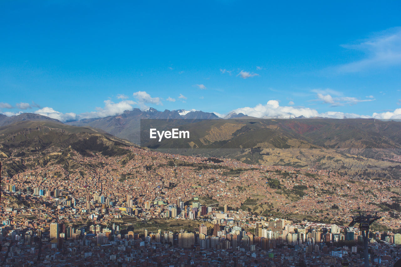 Scenic view of mountains against cloudy sky