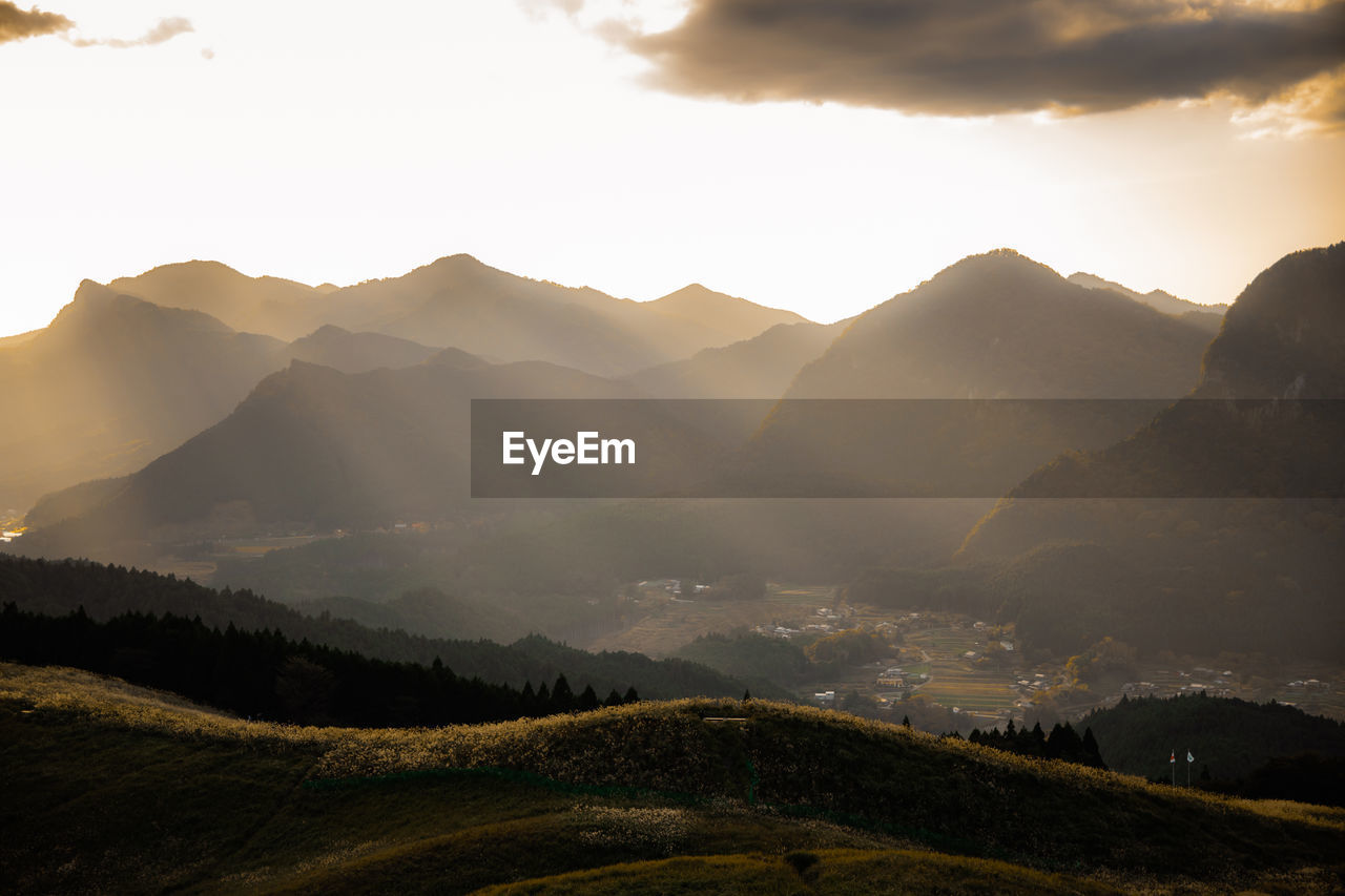 scenic view of snowcapped mountains against sky during sunset