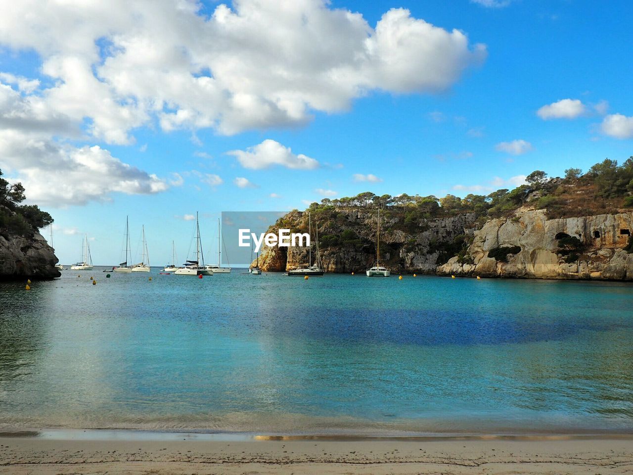 Scenic view of calm sea against blue sky