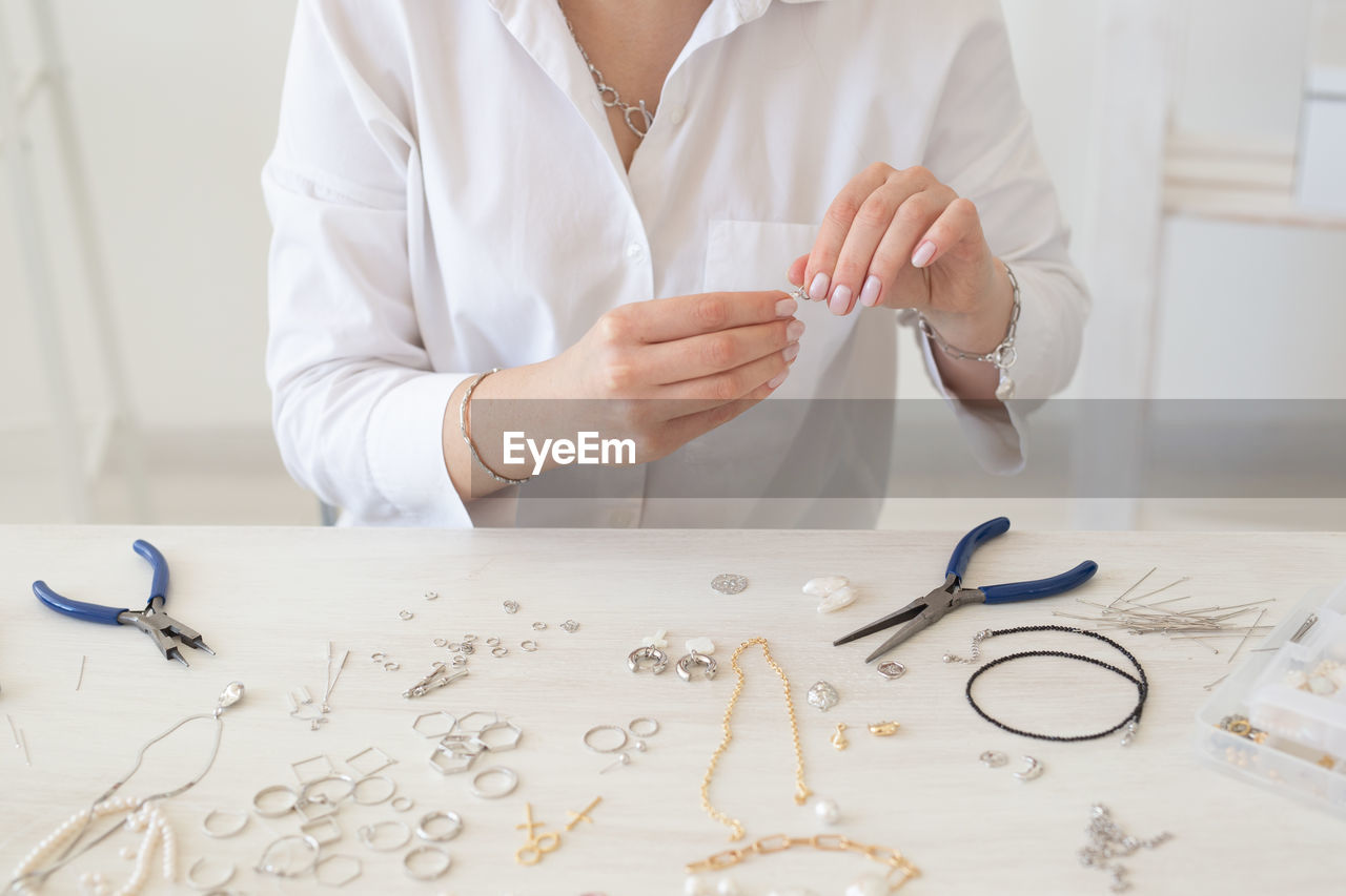 Midsection of woman working on table