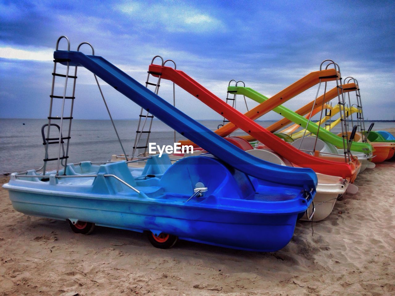 Slides on boats moored at beach