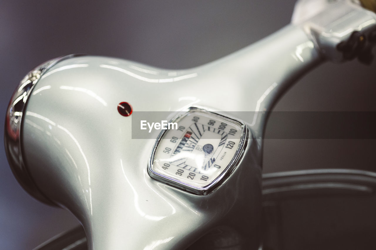 HIGH ANGLE VIEW OF CLOCK ON METAL