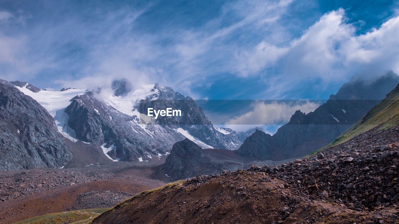 Scenic view of snowcapped mountains against sky