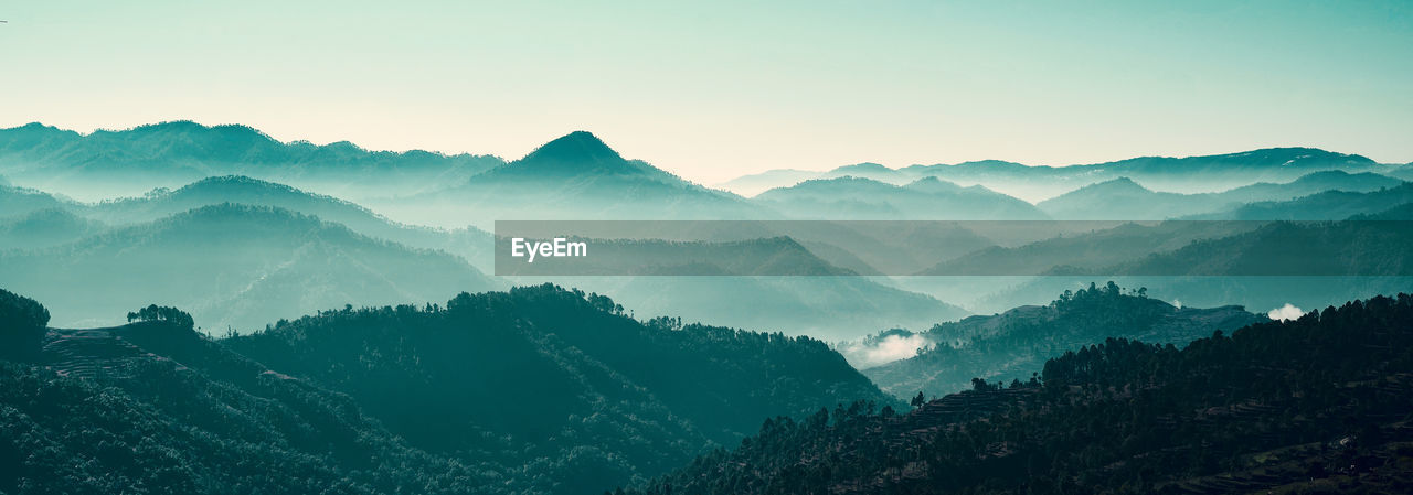 Panoramic view of the mountain range with many layers in the morning