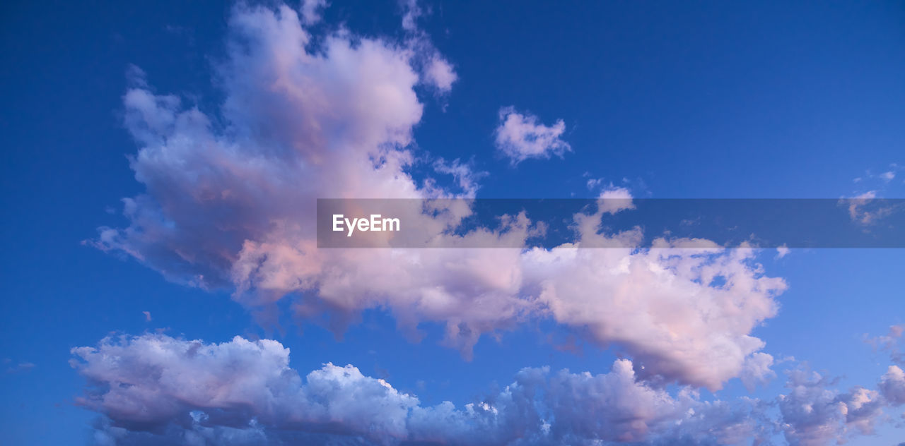 LOW ANGLE VIEW OF CLOUDS AGAINST BLUE SKY