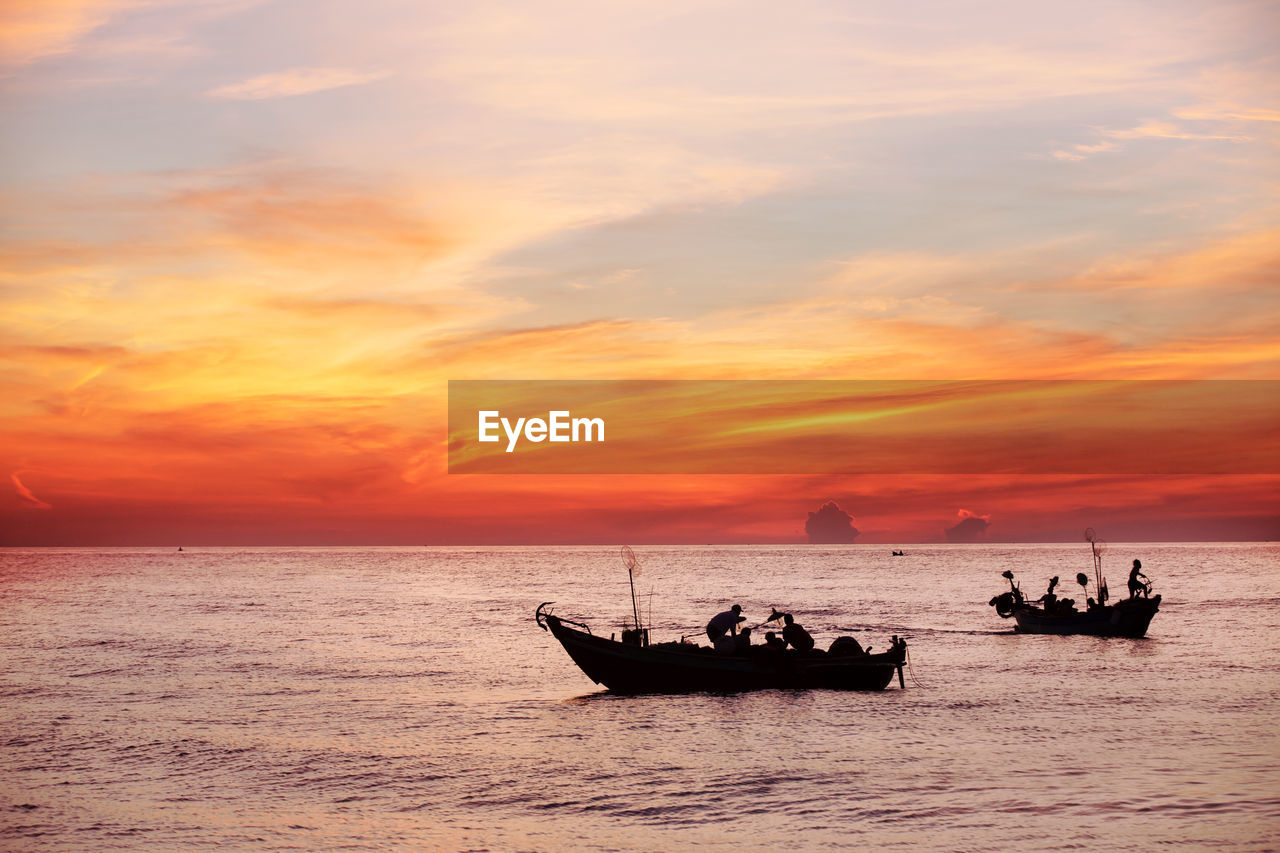 NAUTICAL VESSEL ON SEA AGAINST SKY DURING SUNSET