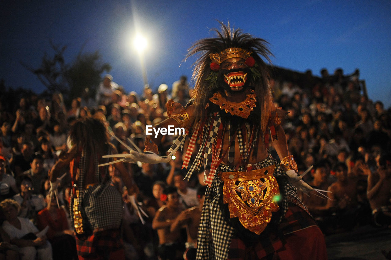 PANORAMIC VIEW OF CROWD DURING FESTIVAL AGAINST SKY