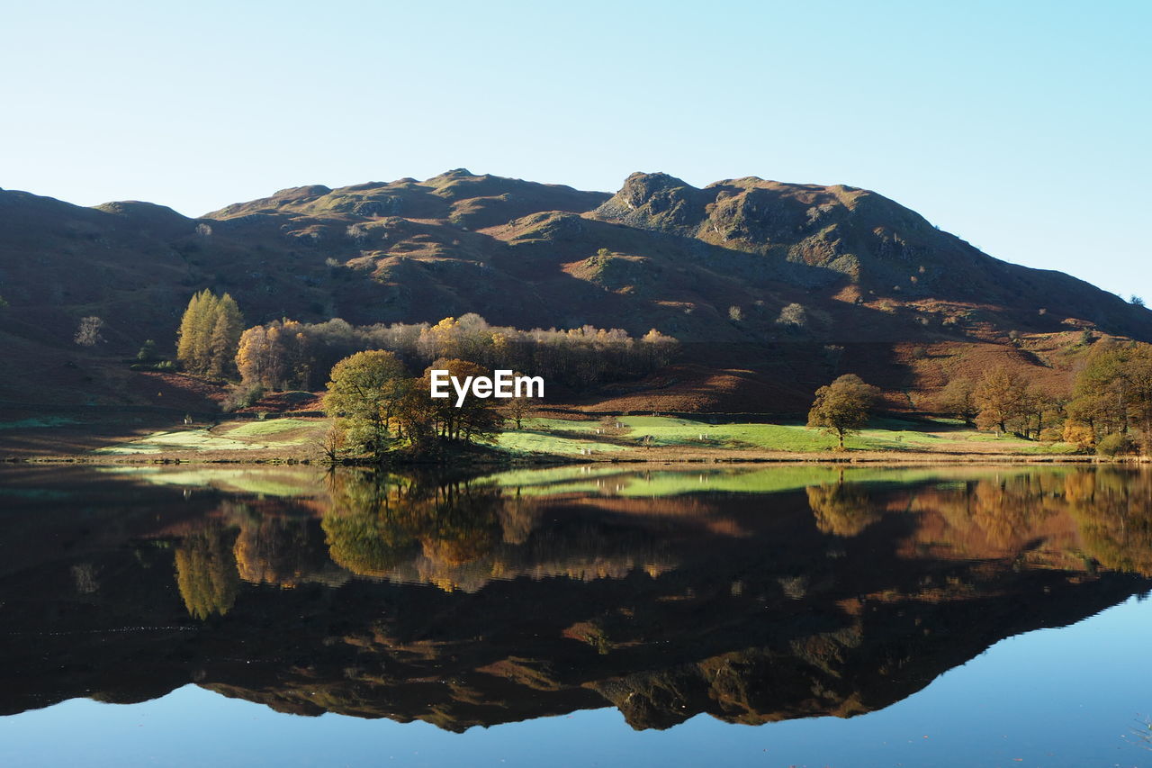 The picturesque nature in late summer reflects in the tranquil lake,river rothay, lake district 2017