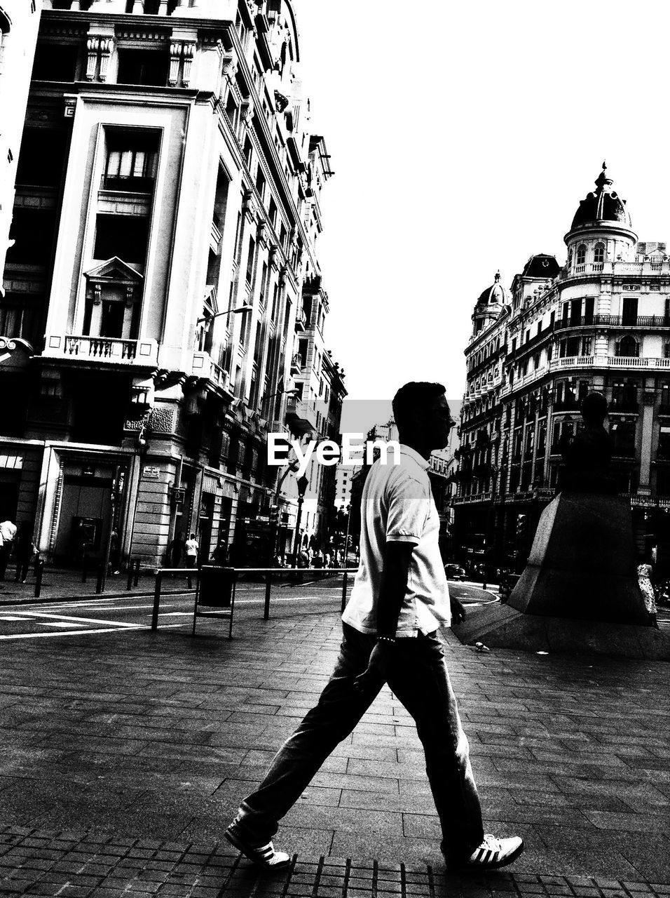 WOMAN WALKING ON CITY STREET