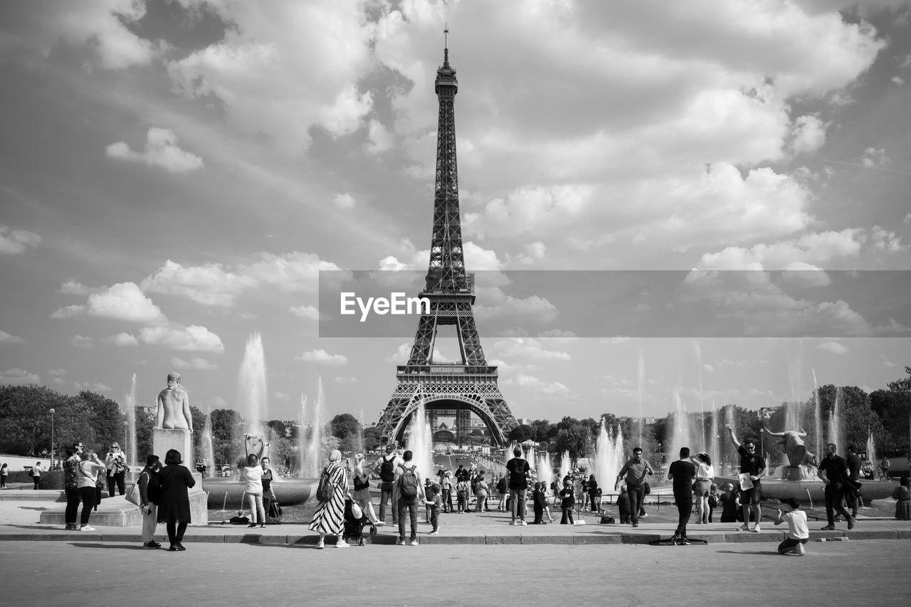 Tourists in front of the eiffel tower, paris, france